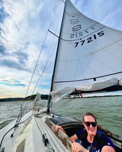 Marin sailing under a full sail on a breezy day